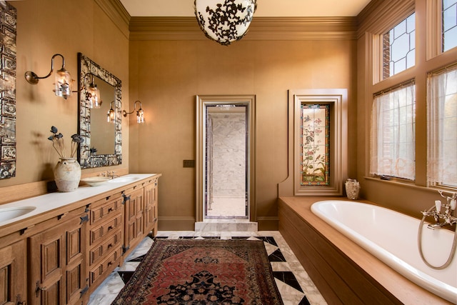 bathroom featuring vanity, ornamental molding, and tiled tub