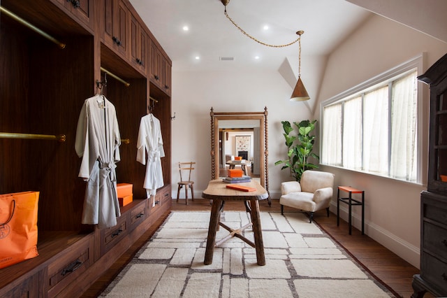 mudroom with lofted ceiling and light hardwood / wood-style flooring