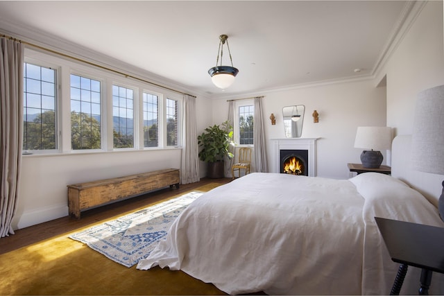 5200 Armour Ranch Rd, Santa Ynez, CA 93460 - bedroom featuring ornamental molding, wood finished floors, and a lit fireplace