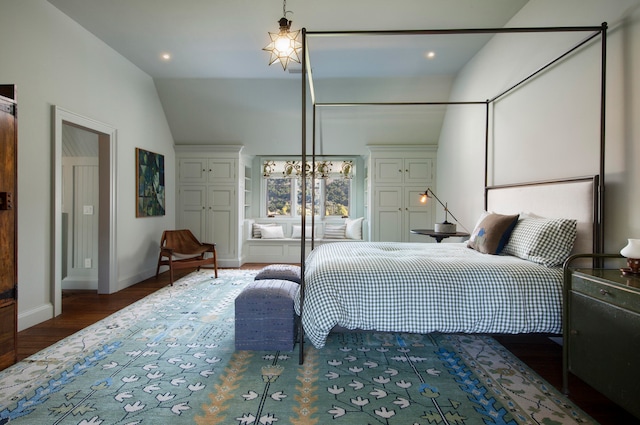 bedroom with hardwood / wood-style floors and vaulted ceiling