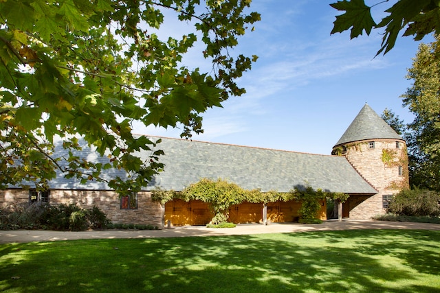 view of property exterior with a yard