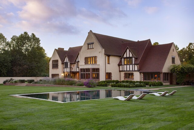5200 Armour Ranch Rd, Santa Ynez, CA 93460 - rear view of property featuring a yard, stucco siding, and a balcony