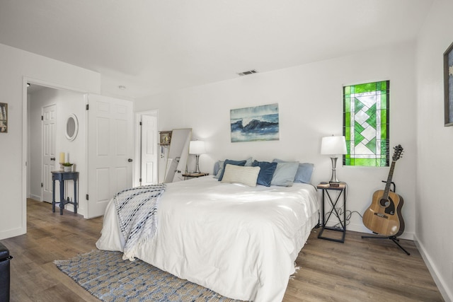 bedroom featuring hardwood / wood-style floors