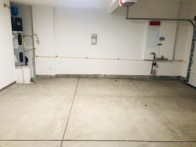 garage with hybrid water heater and a garage door opener