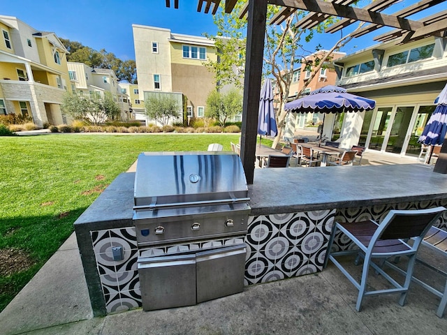 view of patio featuring a pergola and exterior kitchen