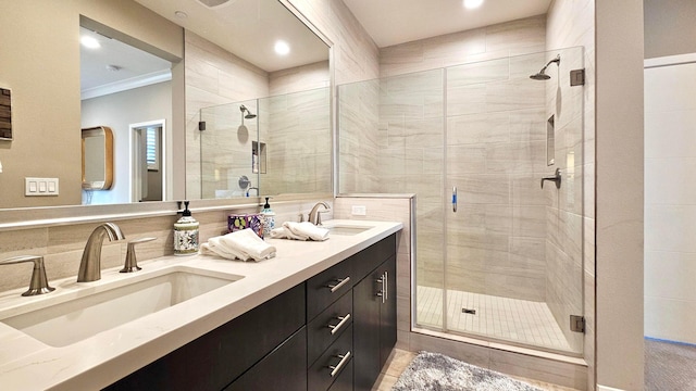 bathroom featuring tile patterned flooring, vanity, an enclosed shower, and ornamental molding