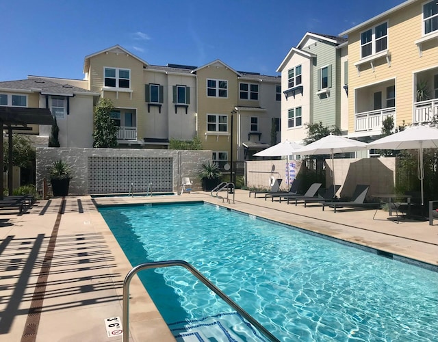 view of swimming pool with a patio area