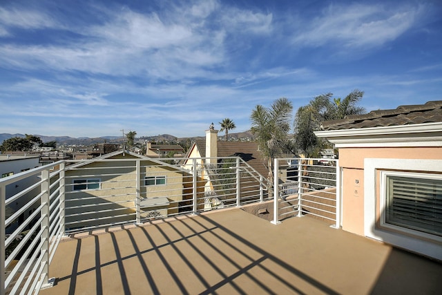 balcony featuring a mountain view