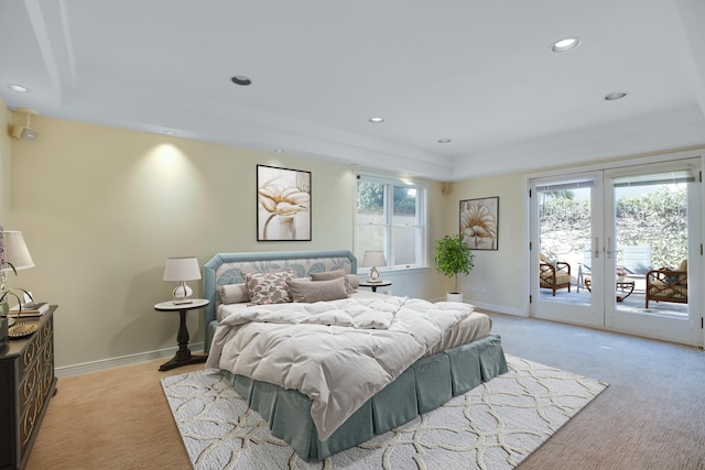 carpeted bedroom with access to outside and french doors