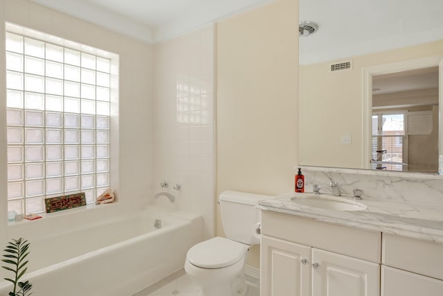 full bathroom with vanity, toilet, and  shower combination