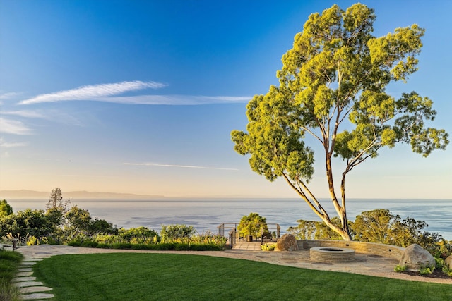 yard at dusk with a water view