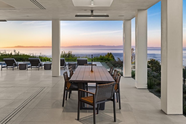 patio terrace at dusk with a water view