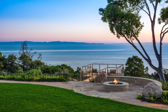 view of water feature featuring a mountain view and a fire pit