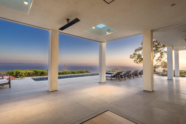 patio terrace at dusk with a water view