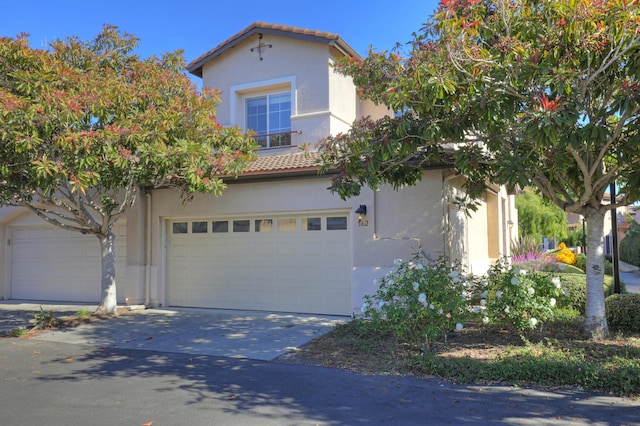 mediterranean / spanish house featuring a garage