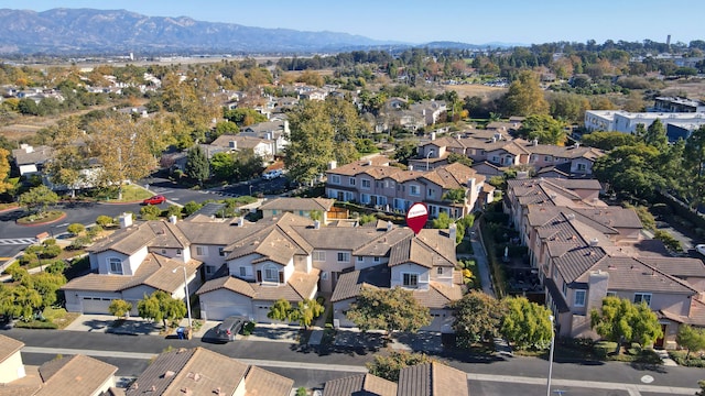 birds eye view of property featuring a mountain view