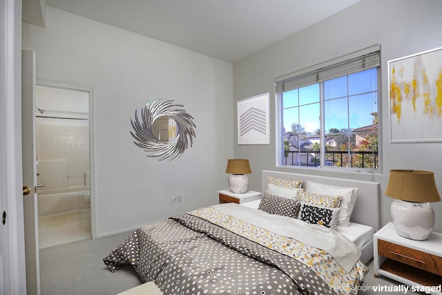 bedroom featuring carpet and ensuite bathroom