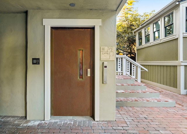 view of exterior entry featuring elevator