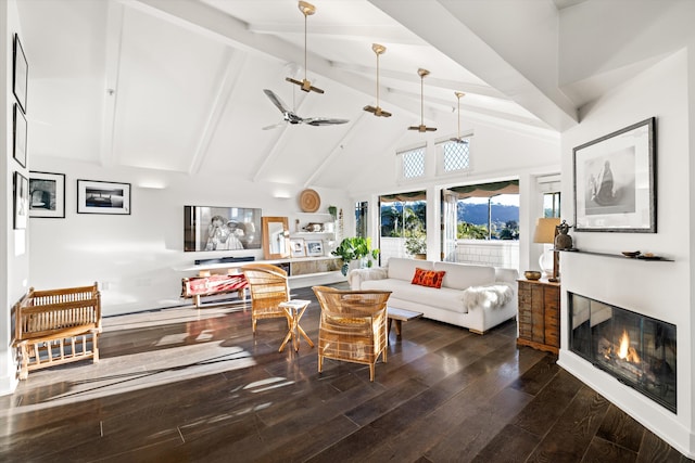 living room featuring beamed ceiling, hardwood / wood-style flooring, high vaulted ceiling, and ceiling fan