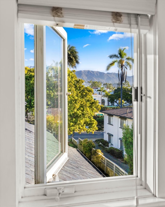 doorway to outside featuring a wealth of natural light and a mountain view