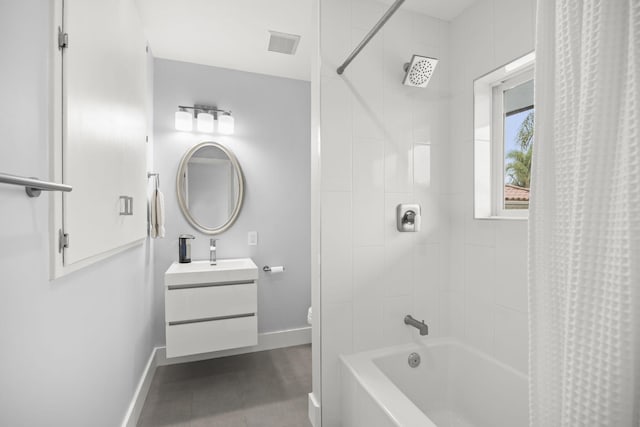 full bathroom with vanity, shower / tub combo, and toilet