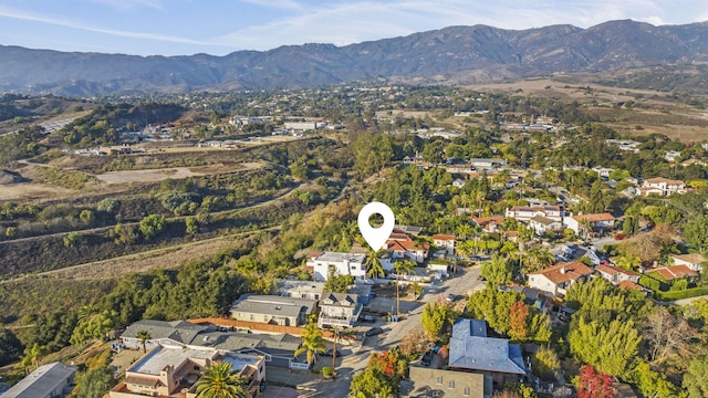 birds eye view of property featuring a mountain view