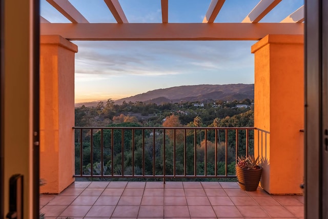 balcony at dusk with a mountain view