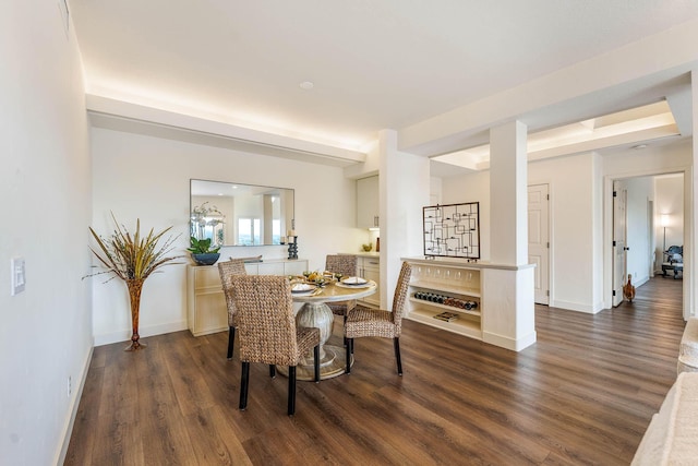 dining space with dark wood-type flooring