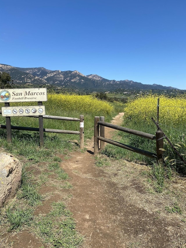 view of gate featuring a mountain view and a rural view