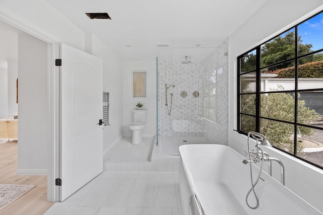 792 Chelham Way, Santa Barbara, CA 93108 - bathroom featuring a soaking tub, tiled shower, toilet, and baseboards