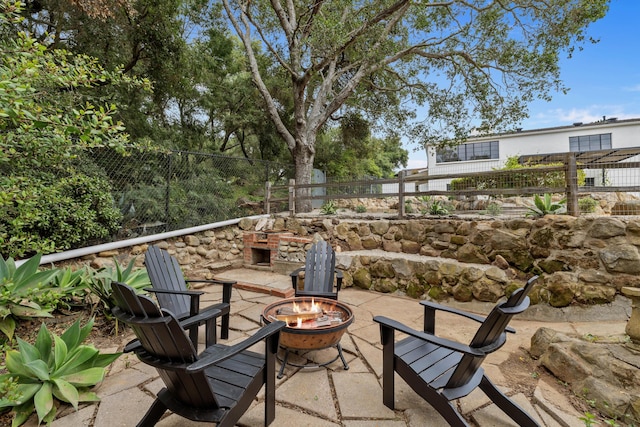 view of patio / terrace with a fire pit