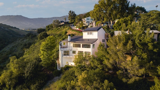 birds eye view of property featuring a mountain view