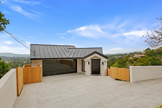 view of front of home with a mountain view and a garage