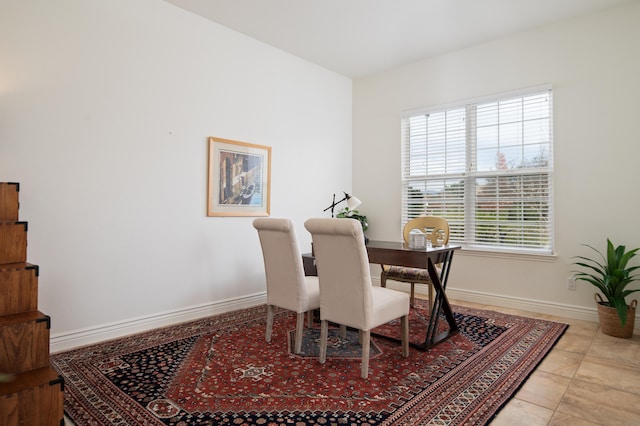 dining space featuring light tile patterned floors