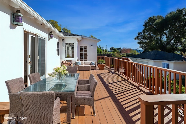 deck featuring outdoor lounge area