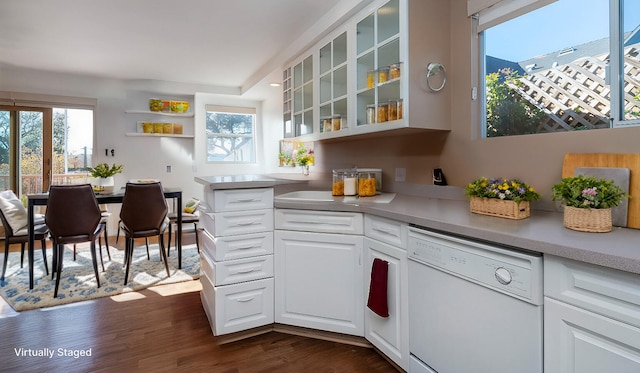 kitchen with dishwasher, white cabinets, dark hardwood / wood-style floors, and a healthy amount of sunlight