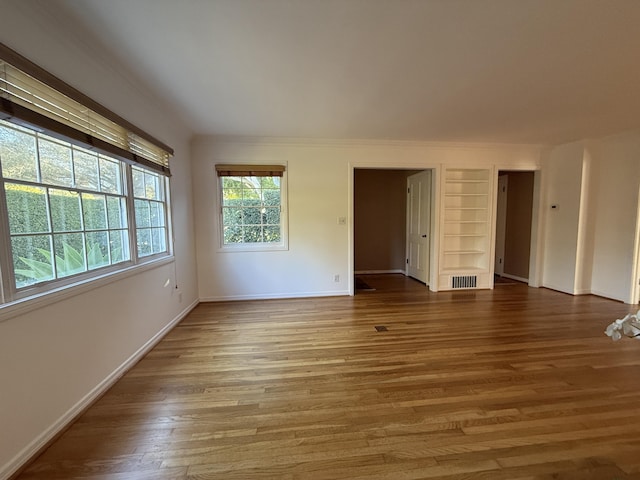 spare room featuring hardwood / wood-style floors