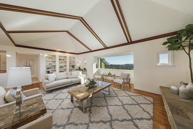 living room featuring wood-type flooring, built in shelves, and lofted ceiling