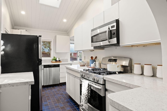 kitchen with white cabinets, stainless steel appliances, lofted ceiling, and wood ceiling