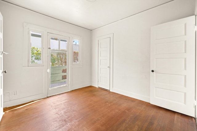 empty room featuring wood-type flooring