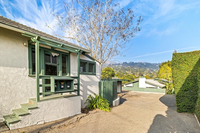 view of home's exterior with a mountain view