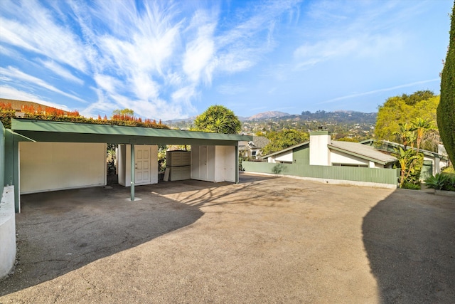 exterior space with a mountain view and a carport