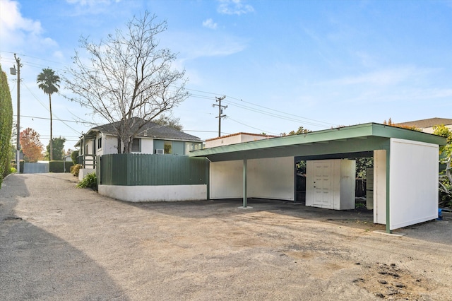 exterior space with a carport