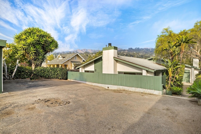 view of side of home featuring a mountain view