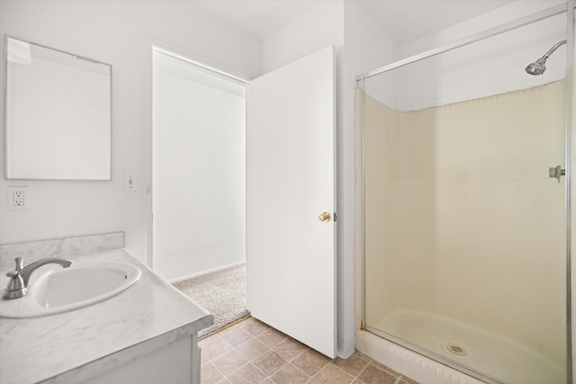 bathroom featuring vanity and a shower