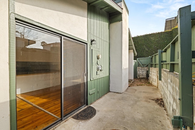 doorway to property with a patio area