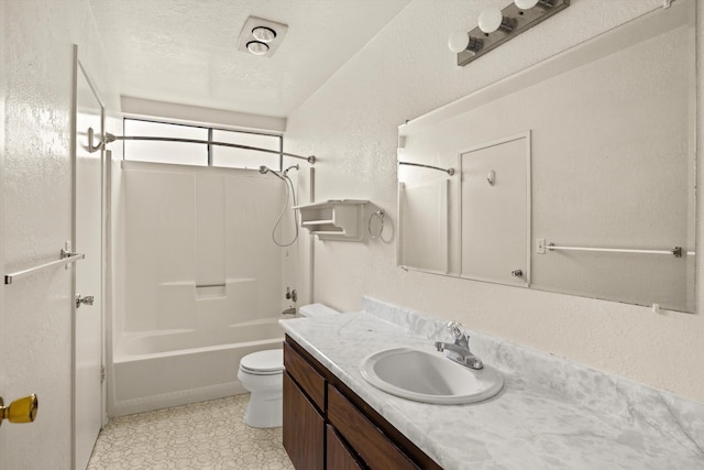 full bathroom featuring a textured ceiling, vanity, toilet, and shower / washtub combination