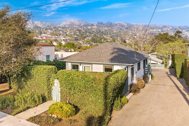 view of side of property with a mountain view