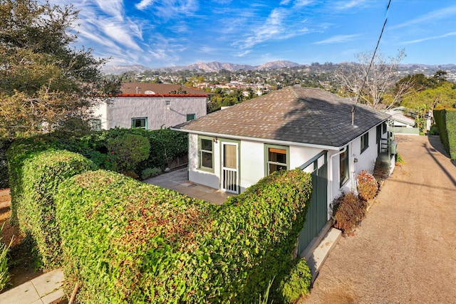 view of property exterior featuring a mountain view