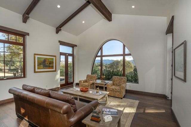 living room featuring plenty of natural light, beamed ceiling, wood-type flooring, and french doors